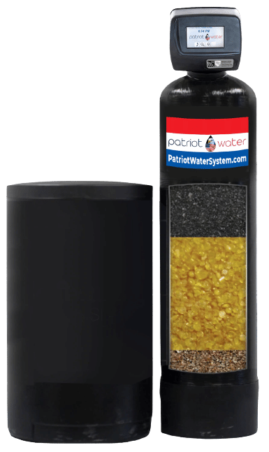 A water filtration system with a control unit and tank on the right, labeled "Patriot Water," and a large black cylindrical container on the left.