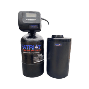 Two black cylindrical water system components, one with a digital display labeled "Patriot Water System" and the other with a lid, designed as part of a Whole House Water Softener setup, both sitting on a white background.