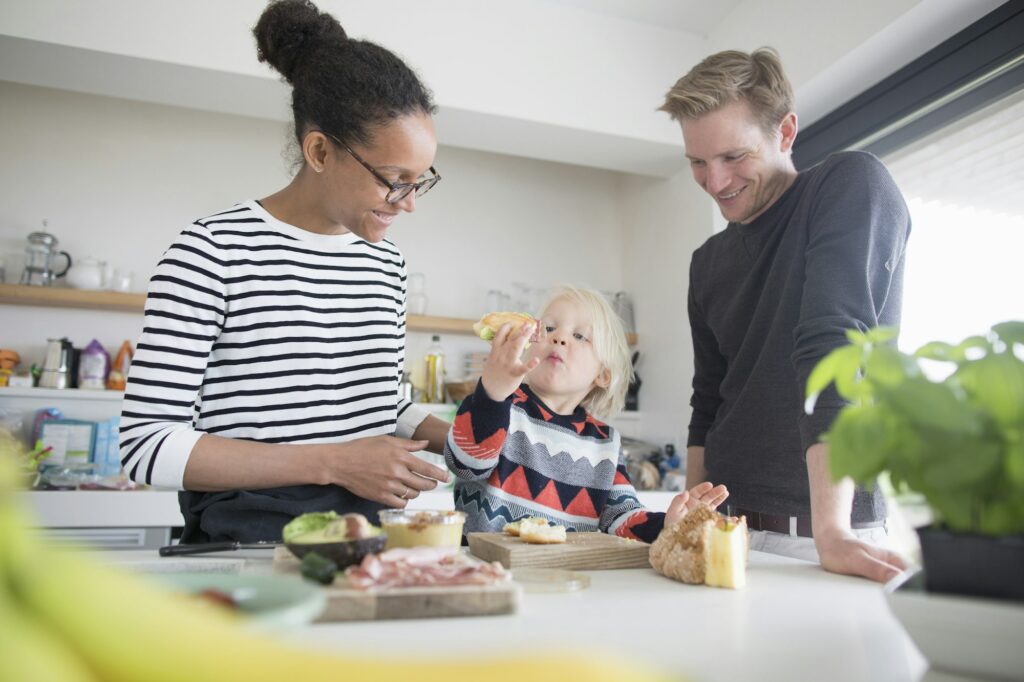 Family preparing food in kitchen